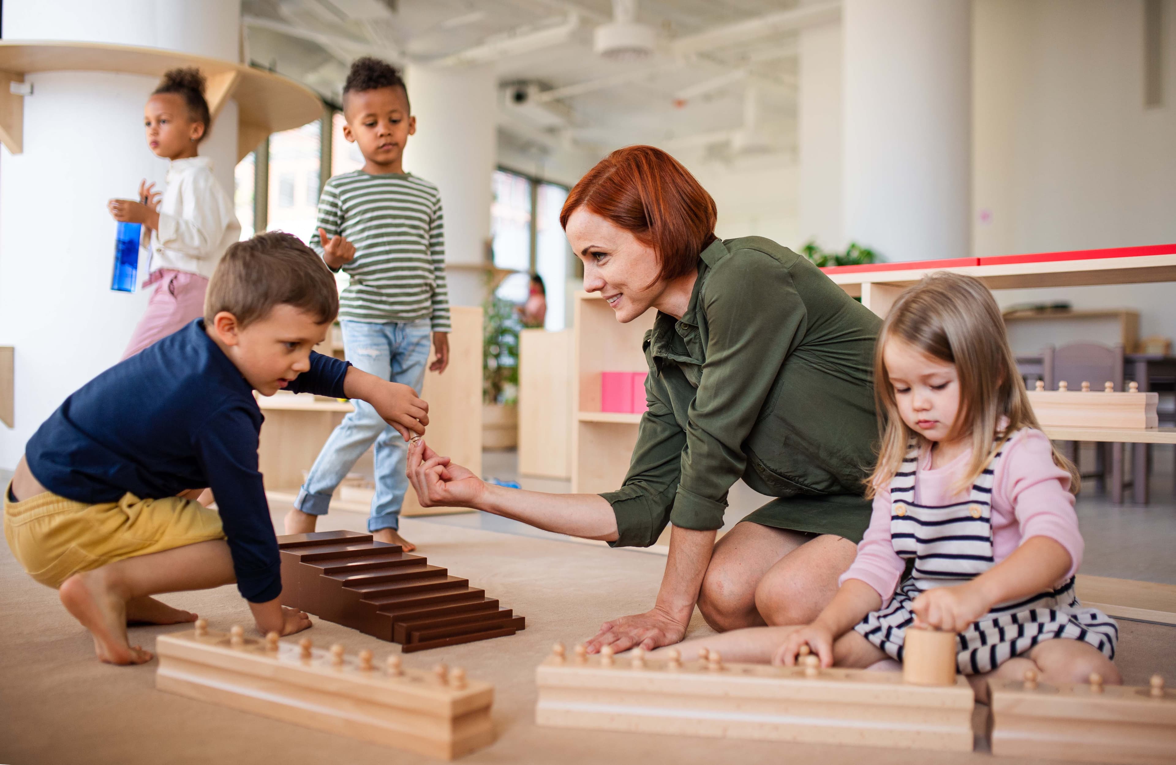 Children playing with natural wooden toys in a Montessori setting