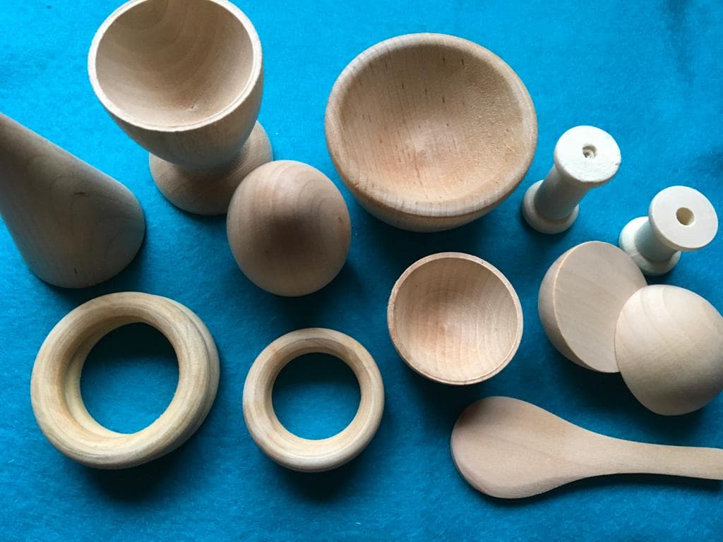 8-piece Montessori wooden toy set with bowls, rings, and spoon
