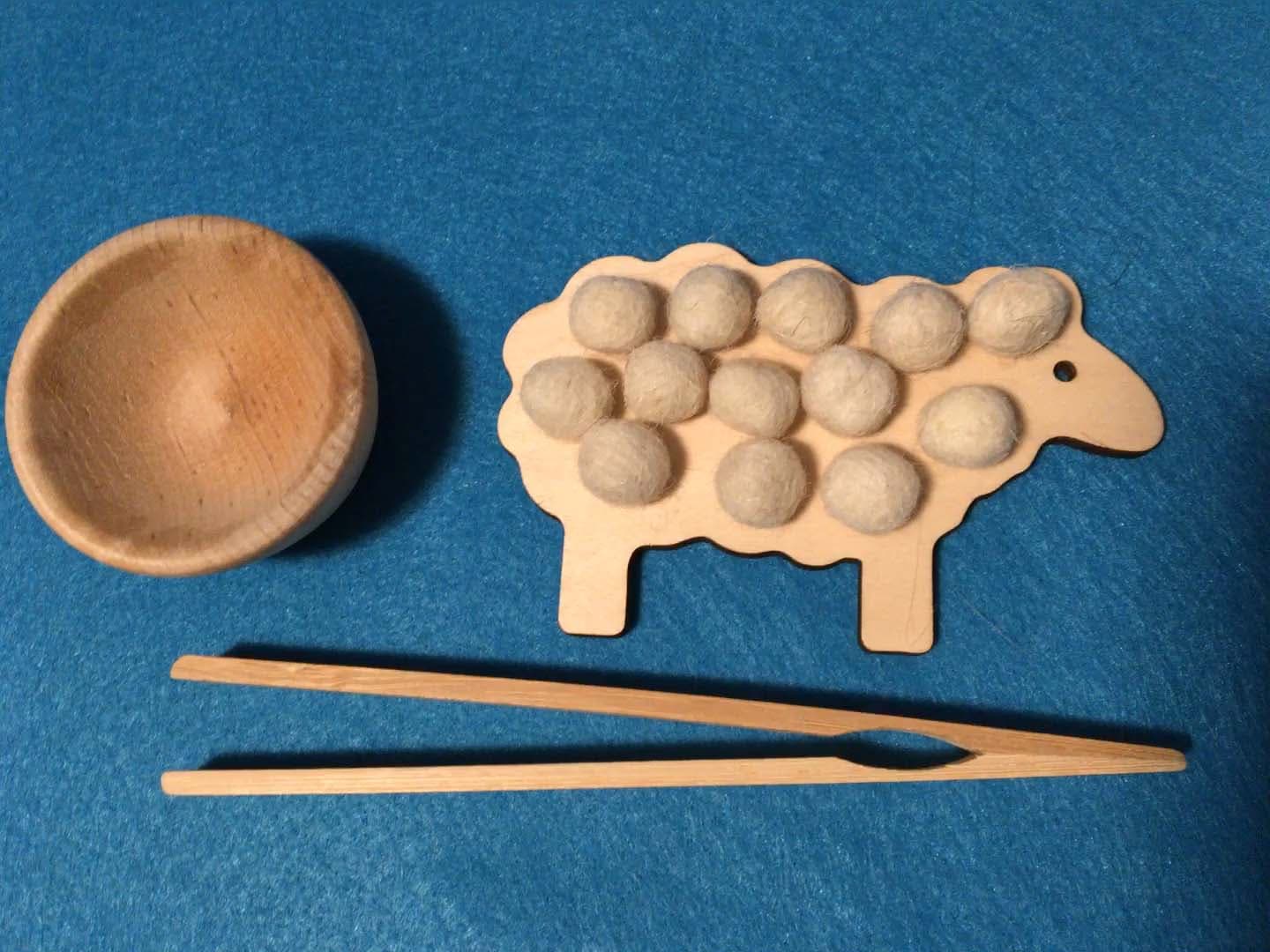 Wooden sheep sorting toy with felt balls and tongs